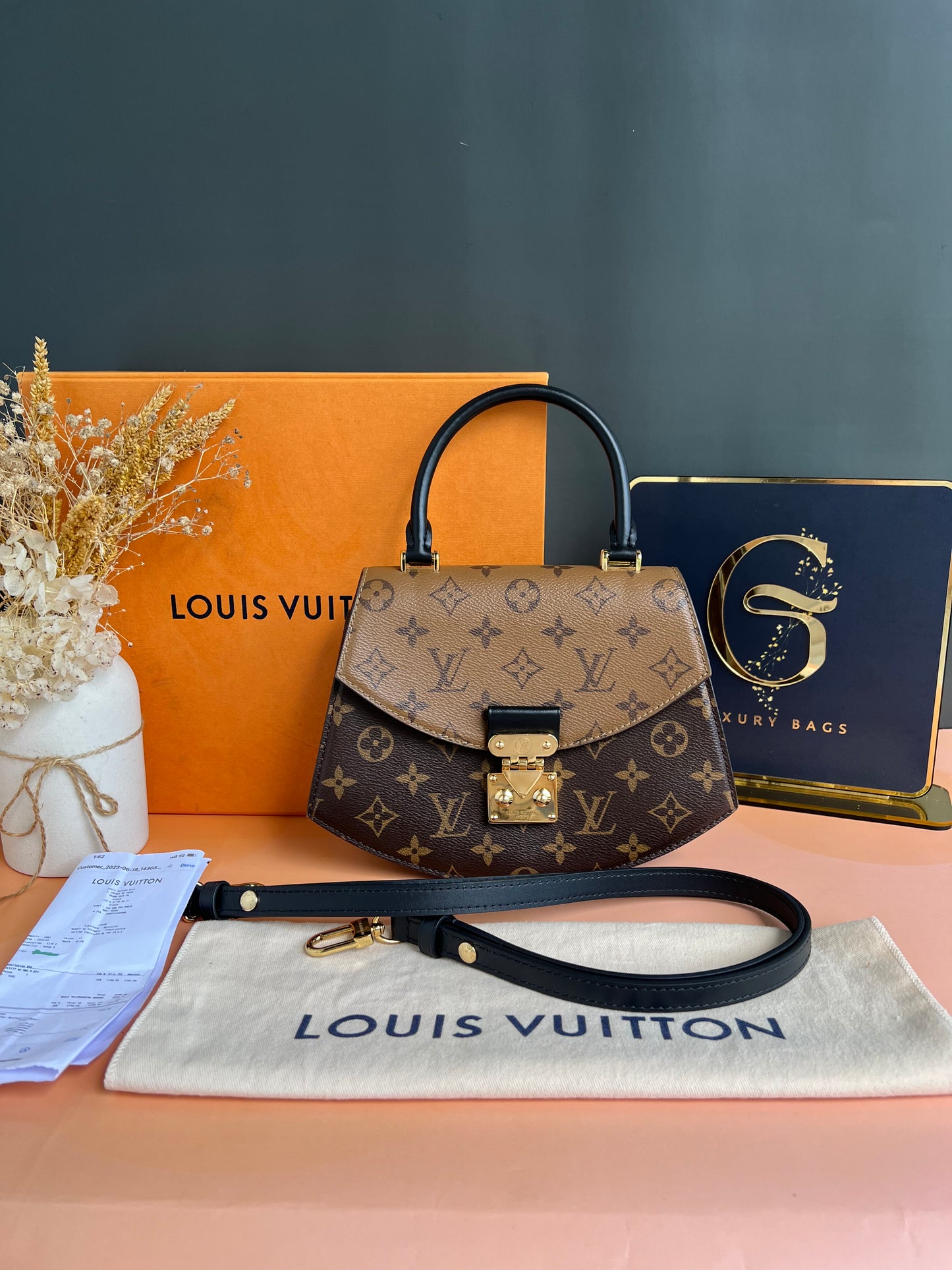 LOUIS VUITTON TILSITT REVERSE MONOGRAM