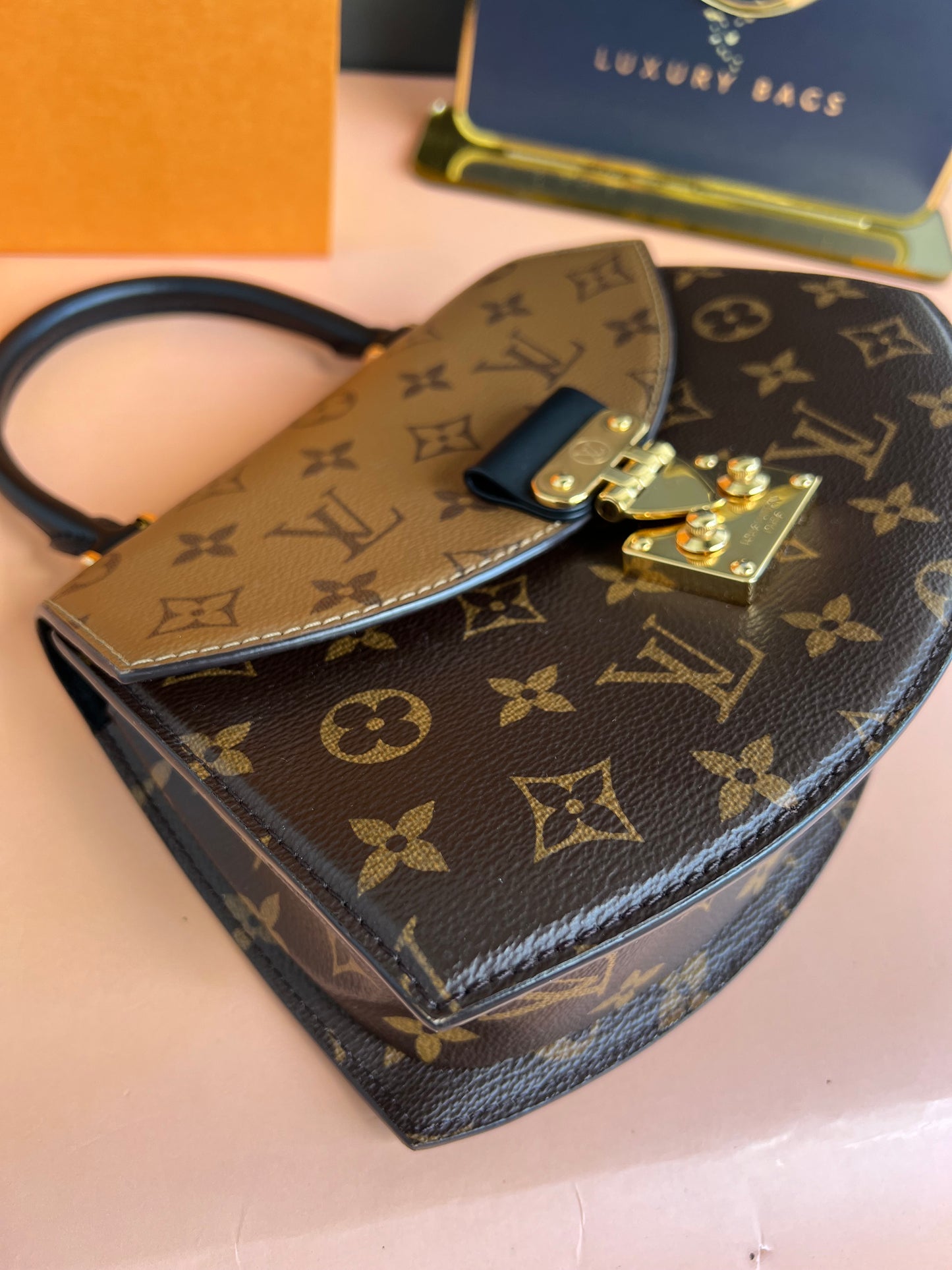 LOUIS VUITTON TILSITT REVERSE MONOGRAM